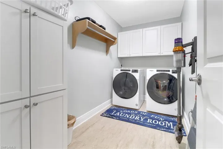 Laundry area with cabinet space and washer and dryer