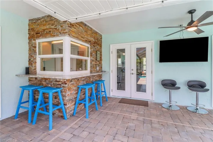 View of patio / terrace with ceiling fan and french doors