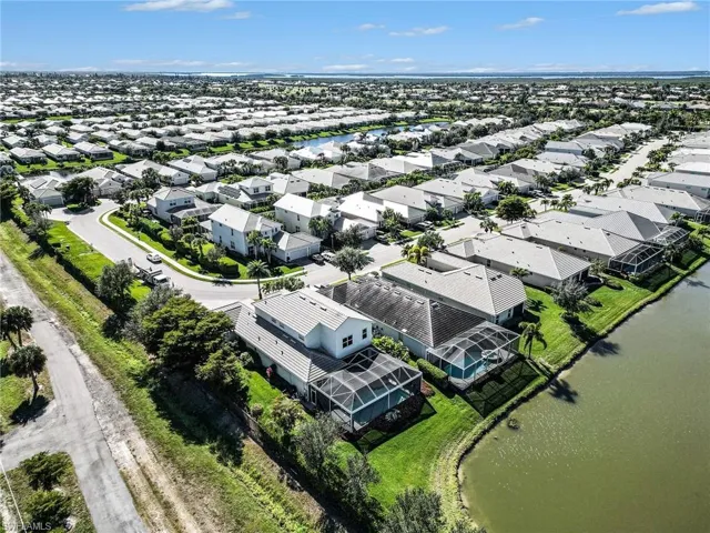 Aerial view of residential area with a large body of water