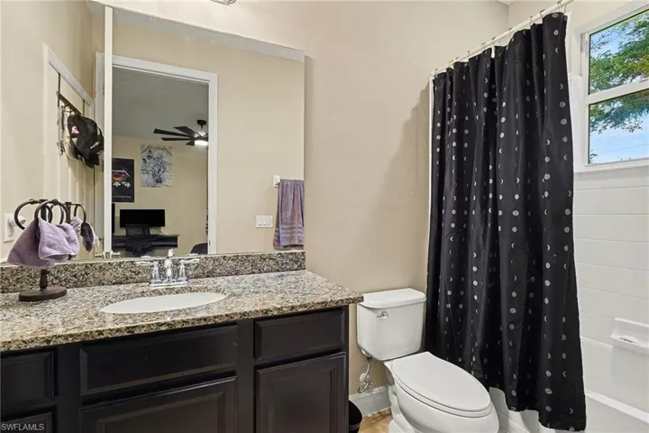 Full bath with shower / bath combo and vanity