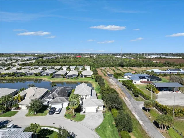 Aerial view of residential area featuring a large body of water