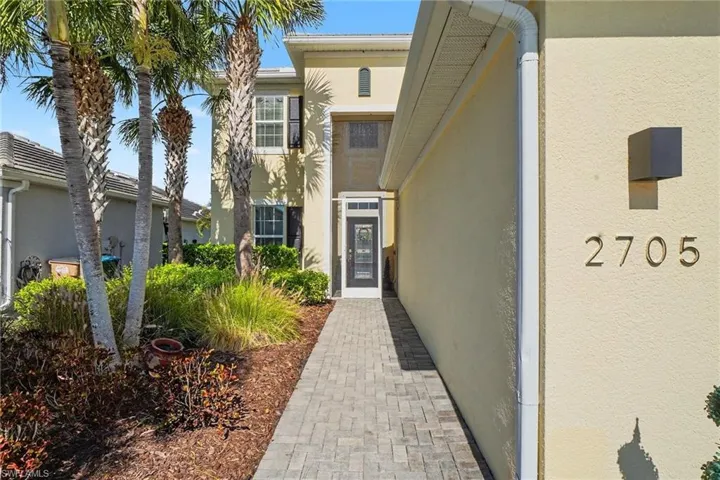 View of exterior entry with stucco siding
