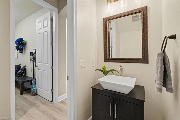 Bathroom featuring vanity and light wood finished floors