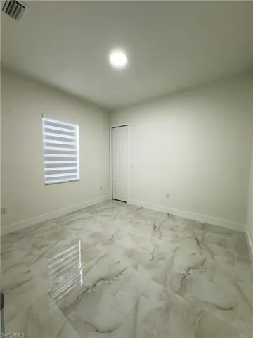 Unfurnished room with marble finish flooring
