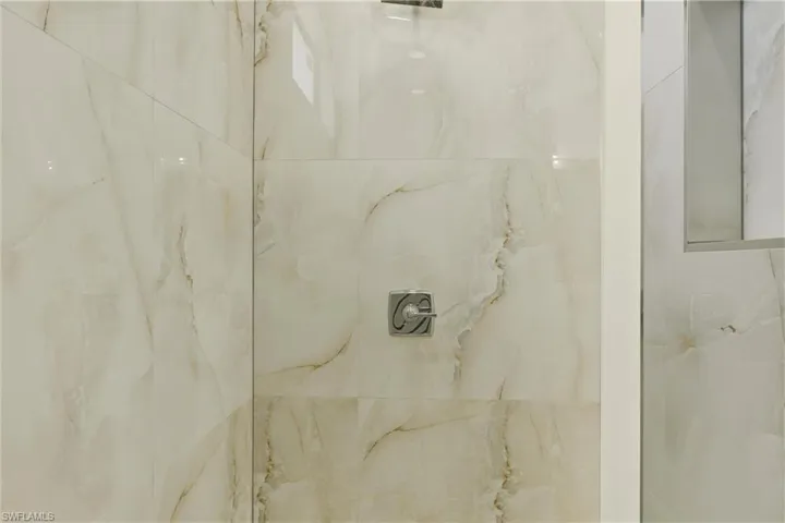 Bathroom view of a marble finish shower