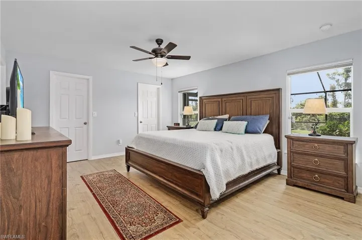 Bedroom featuring light wood-type flooring and ceiling fan