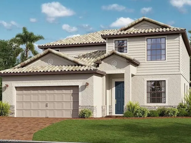 View of front of home featuring a garage and a front yard