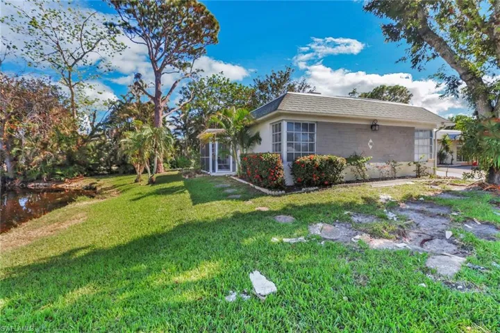 View of side of property with a yard