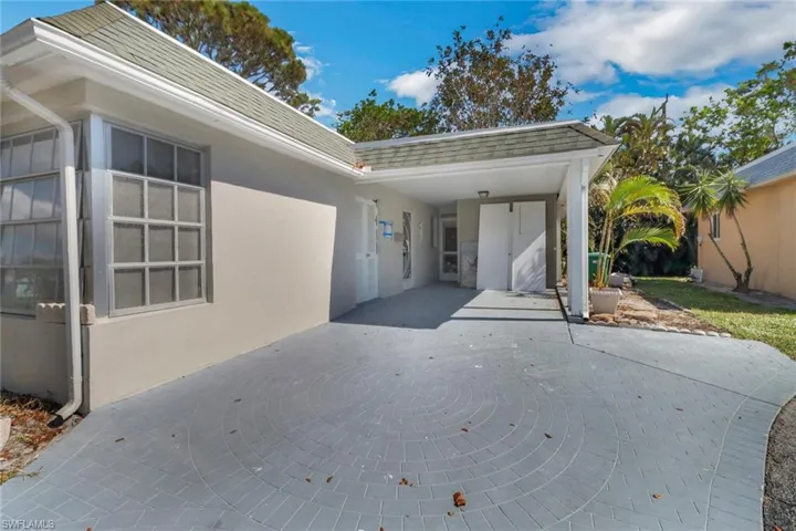 View of patio featuring a carport