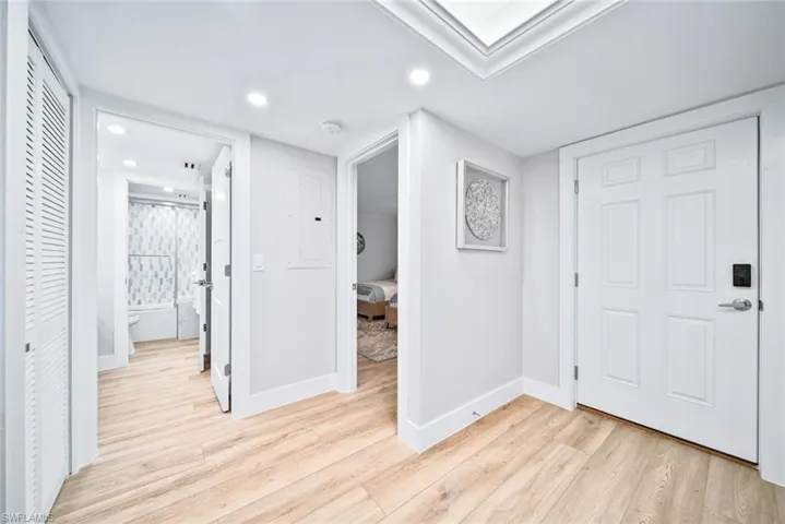 Foyer featuring light wood tile flooring