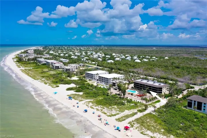 Bird's eye view featuring a view of the beach and a water view