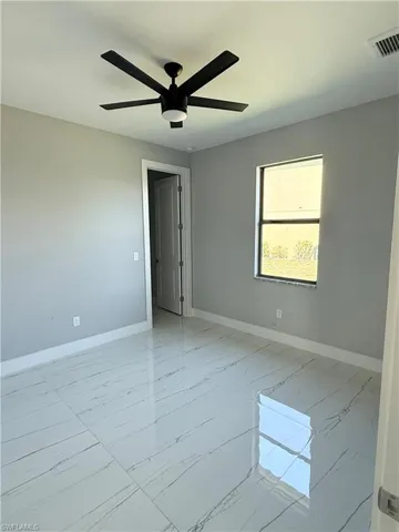 Spare room featuring ceiling fan