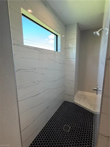 Bathroom with tiled shower