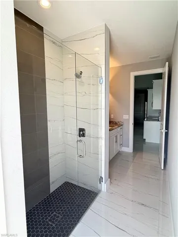 Bathroom featuring vanity and walk in shower