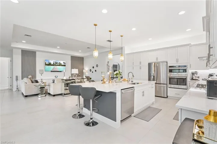 Open concept great room, gourmet kitchen and formal dining room.