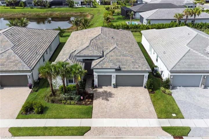 Lake view and privacy hedges behind the home.