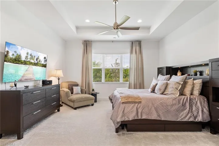 Large primary bedroom with sitting area, 2 walk-in closets.