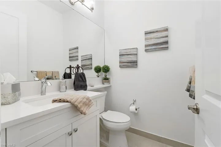 Guest powder room off foyer.