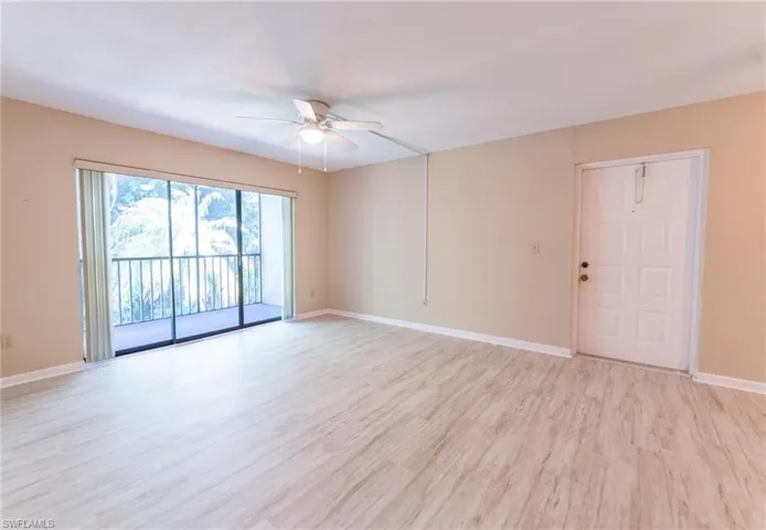 Unfurnished room featuring ceiling fan and light hardwood / wood-style flooring