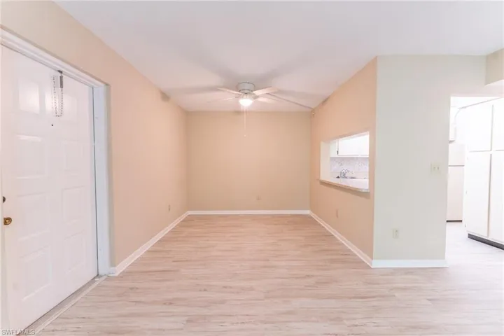 Unfurnished room featuring light hardwood / wood-style floors, sink, and ceiling fan
