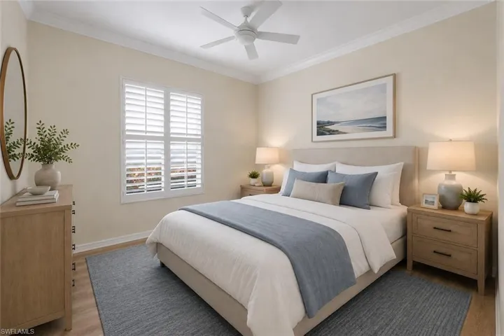 Recessed window with plantation shutters, crown molding, wood-finish flooring, and a ceiling fan