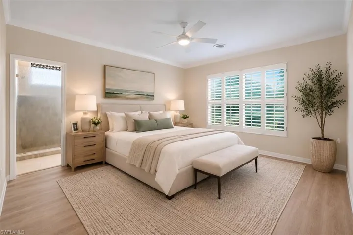Wood-finish flooring with crown molding, ceiling fan, and window with plantation shutters