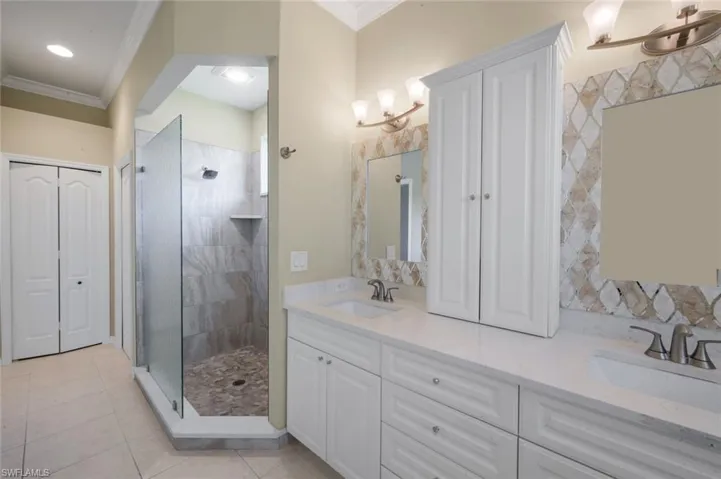 Dual vanity with integrated sinks and white cabinetry