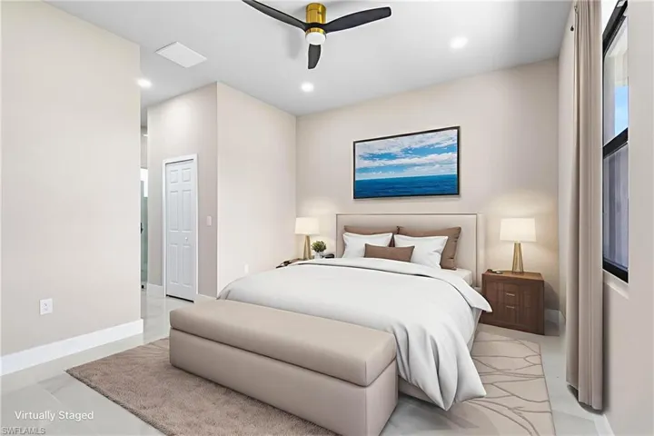 Bedroom with a ceiling fan and recessed lighting