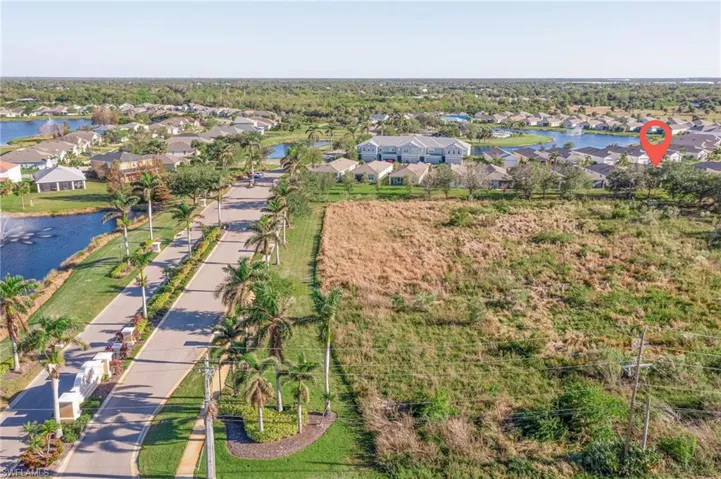 Aerial perspective of suburban area with a large body of water
