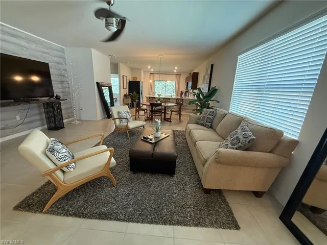 Living area featuring light tile patterned flooring