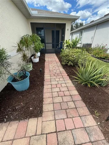 View of patio featuring a sunroom
