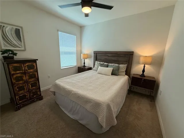 Bedroom with carpet and ceiling fan