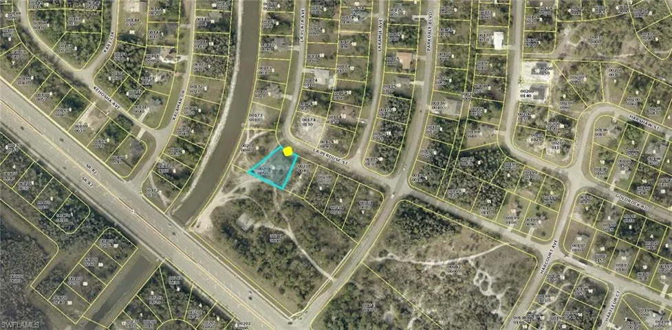Aerial map of property and surrounding area featuring property boundaries highlighted