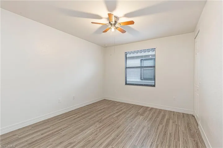 Spare room featuring light wood finished floors and a ceiling fan