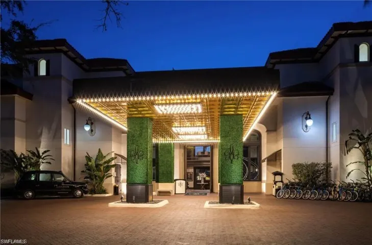Front of the Bellasera Resort with Valet services and community bicycles
