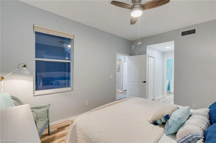 Bedroom with light wood-type flooring and ceiling fan