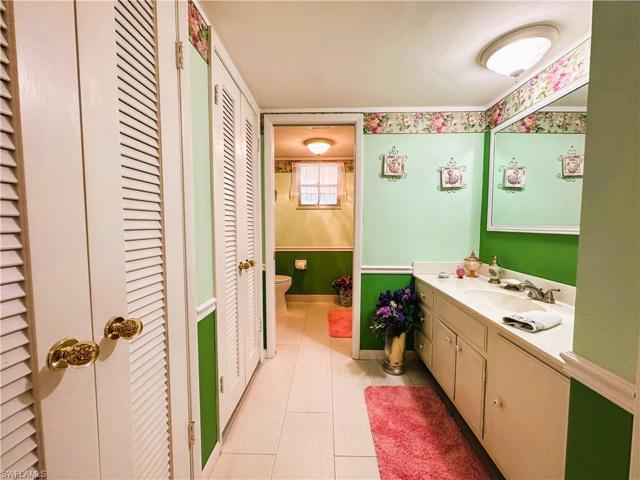 Guest bath from hallway with guest closets