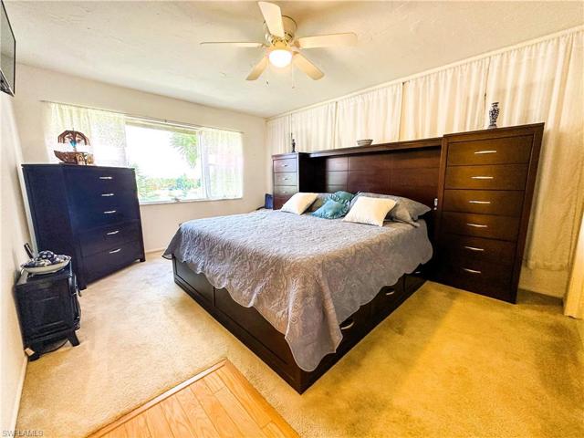 Master bedroom with view to pool and lake