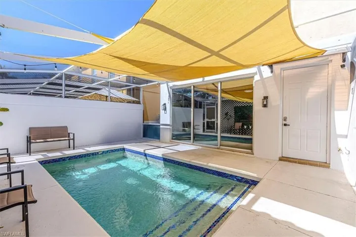 Swimming pool with a patio area and a lanai