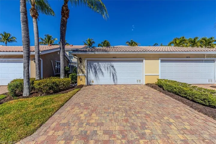 Single story home with a tiled roof and stucco siding
