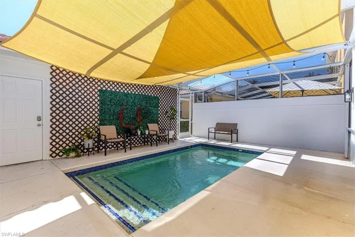 Swimming pool with a patio and a lanai