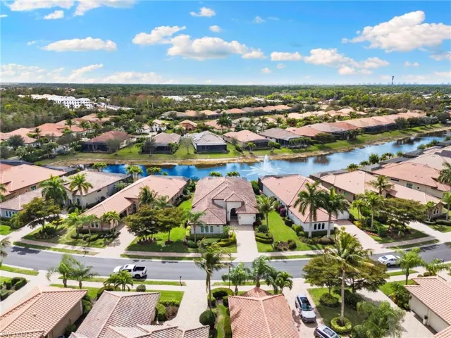 Aerial perspective of suburban area with a nearby body of water