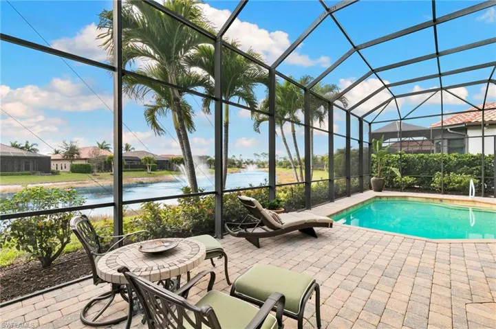 Swimming pool with glass enclosure and a sunroom