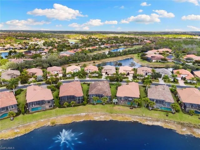Aerial perspective of suburban area with a large body of water