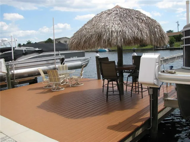 entertainment deck with Tiki hut and tables/chairs