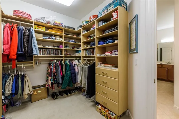 Walk in closet featuring light tile patterned floors