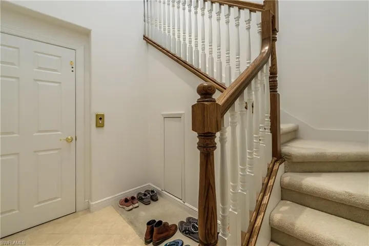 Staircase featuring tile patterned flooring