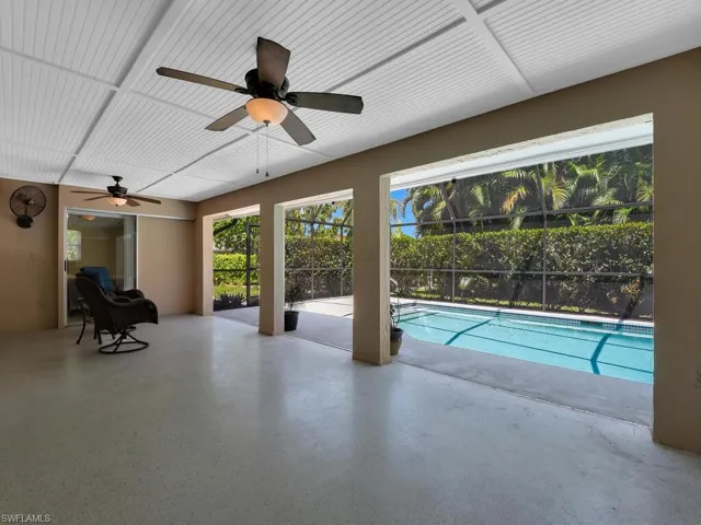 View of pool with ceiling fan
