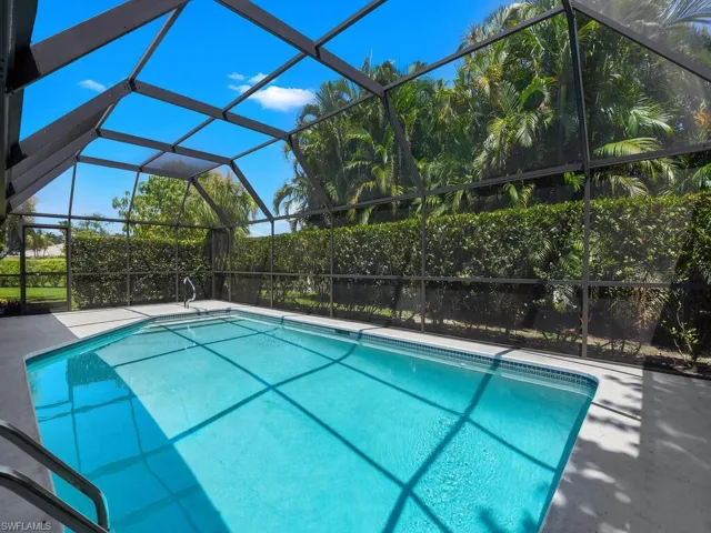 View of pool with glass enclosure