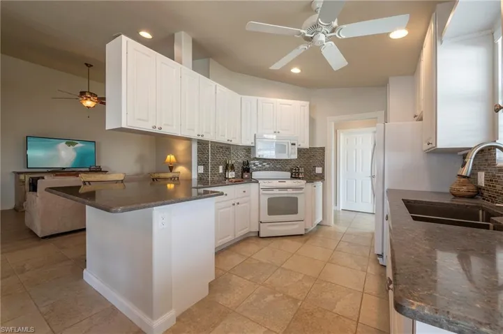 15416 Almaco Cir Bonita Springs FL 34135 - Kitchen with granite countertops and undercount sink